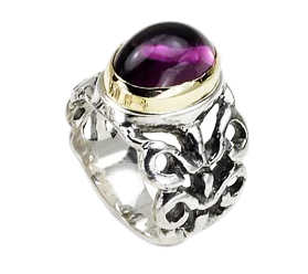 Sterling Silver Ring with Carvings and Garnet Stone