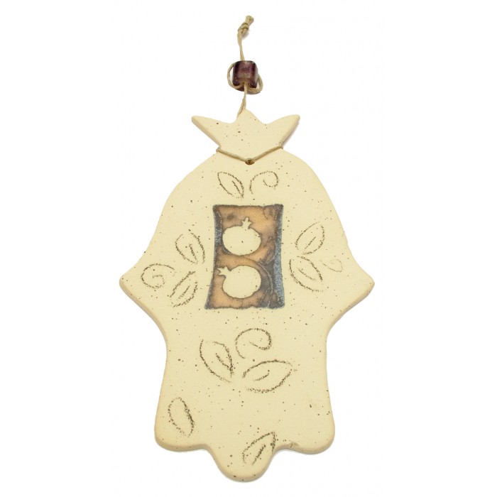 White Ceramic Hamsa with Leaves and Pomegranates on Brown Background